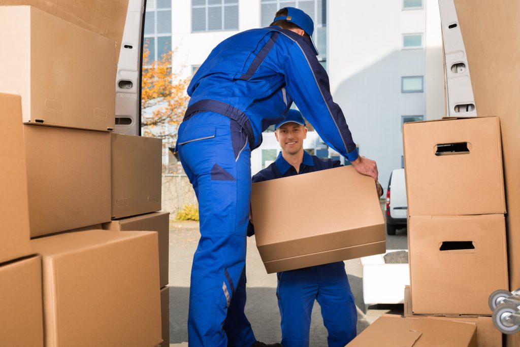 صفحه اصلی 6 men moving boxes off a moving truck 2 1024x684 1